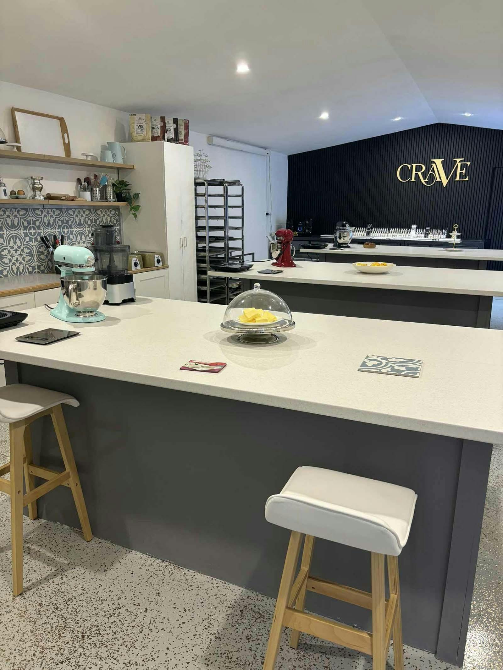 Crave School Kitchen featuring work benches and mixer