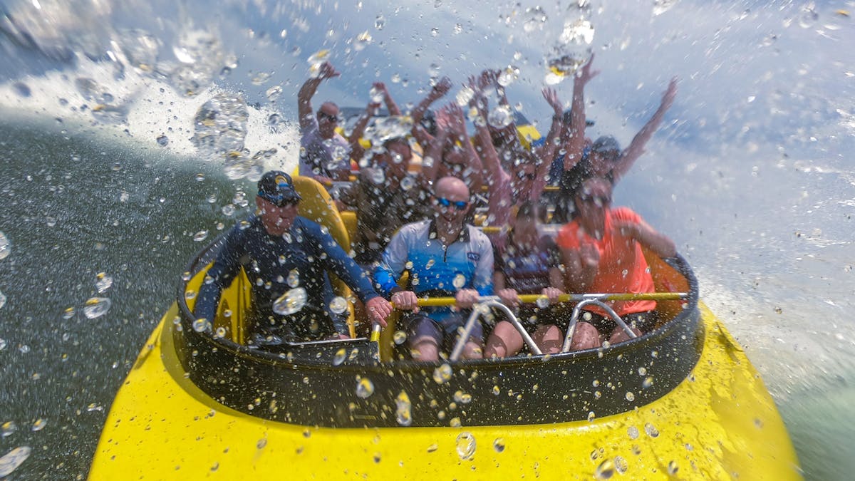 Passengers enjoying jet boat ride