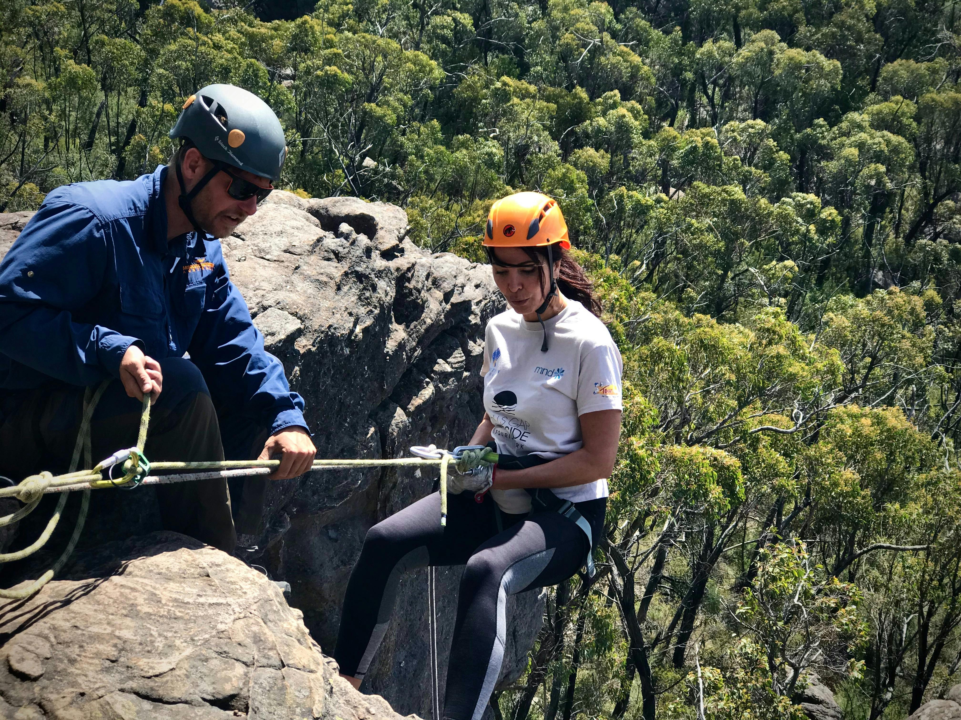 Qualified and experienced guides abseiling