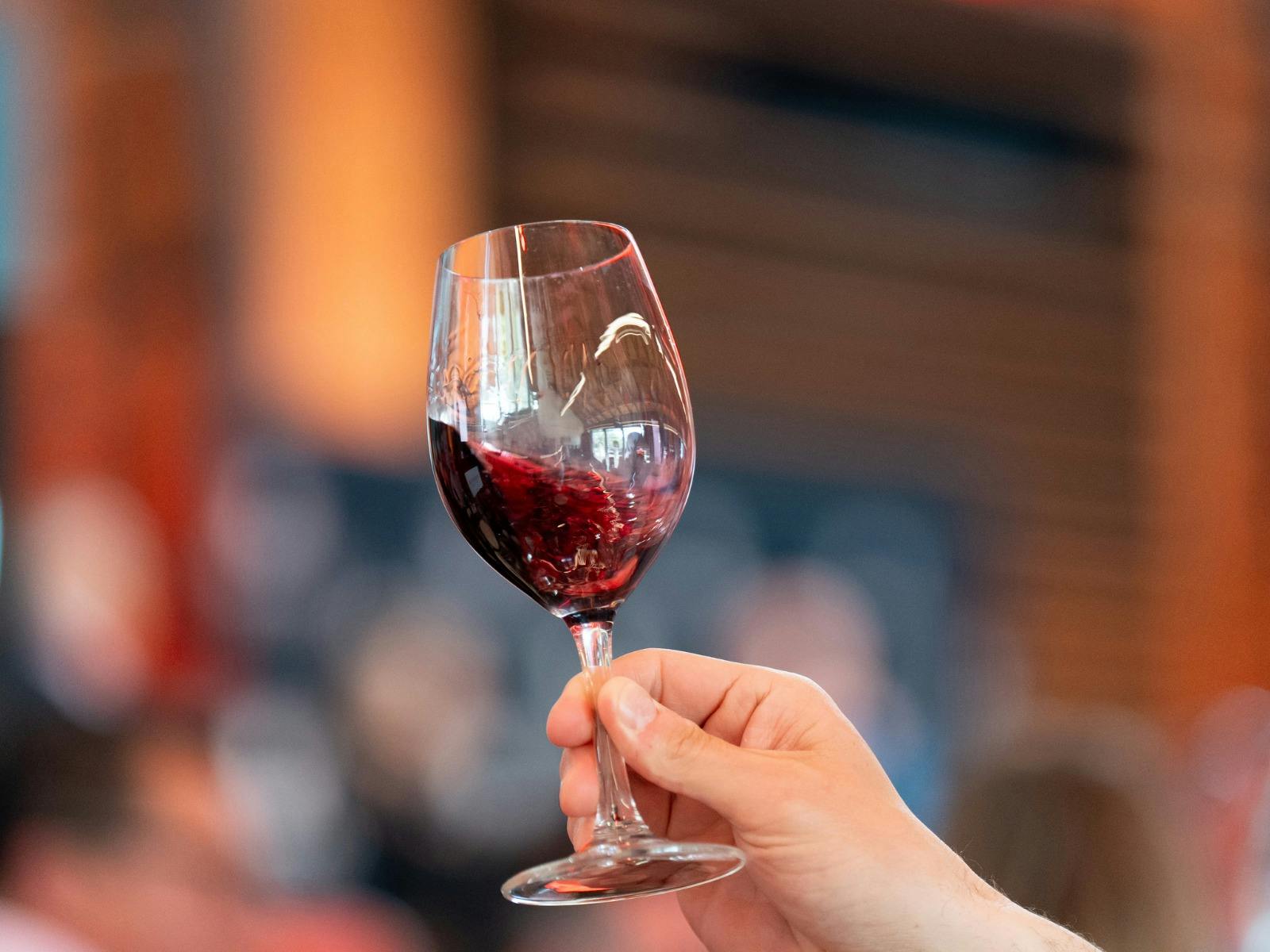 Red wine swirling in wine glass