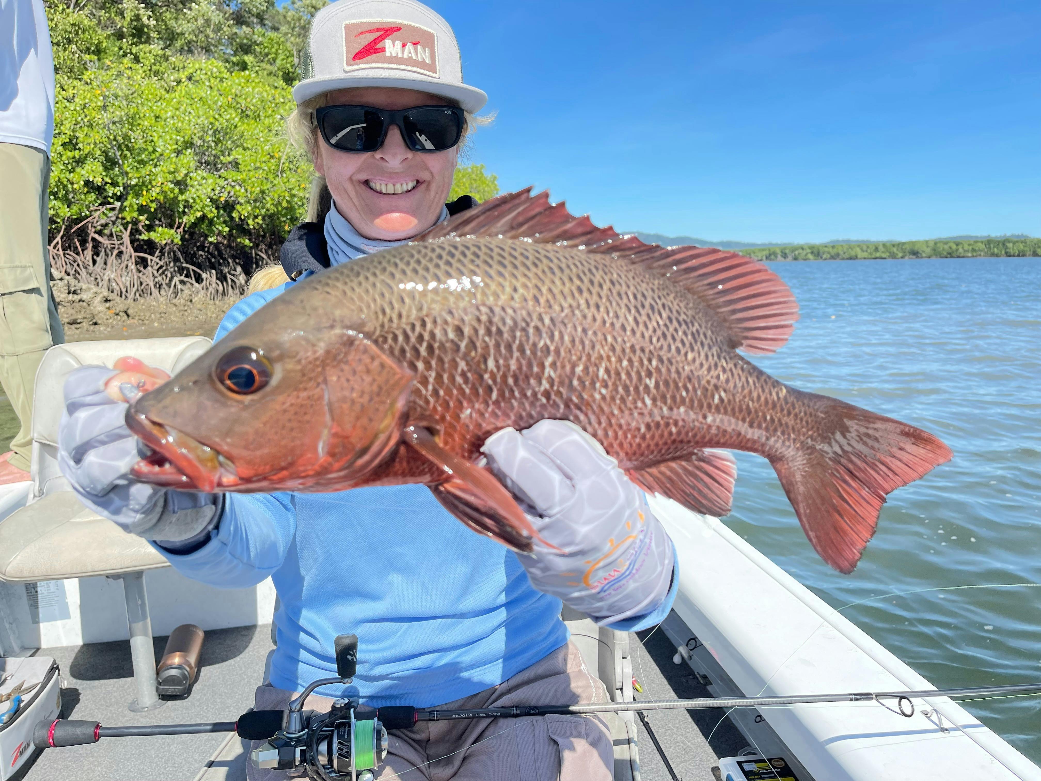 The bright red colors of the Mangrove jack caught on plastics in the Hinchinbrook Channel