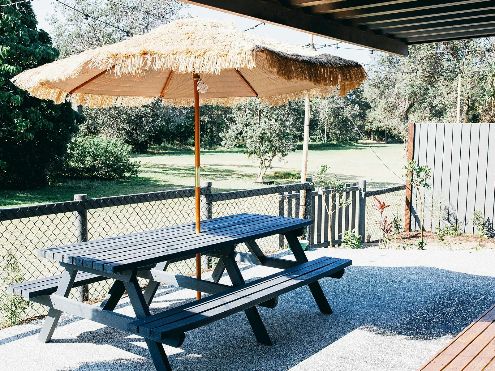 Cypress Room Patio with Picnic Table and Bali Umbrella