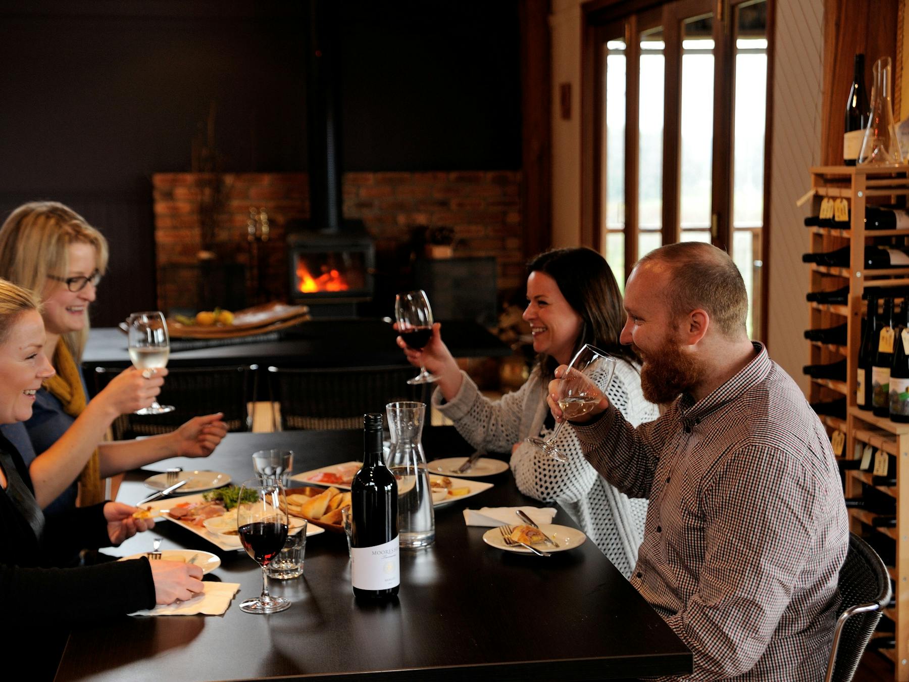 Enjoy a platter and a bottle of wine by the fire