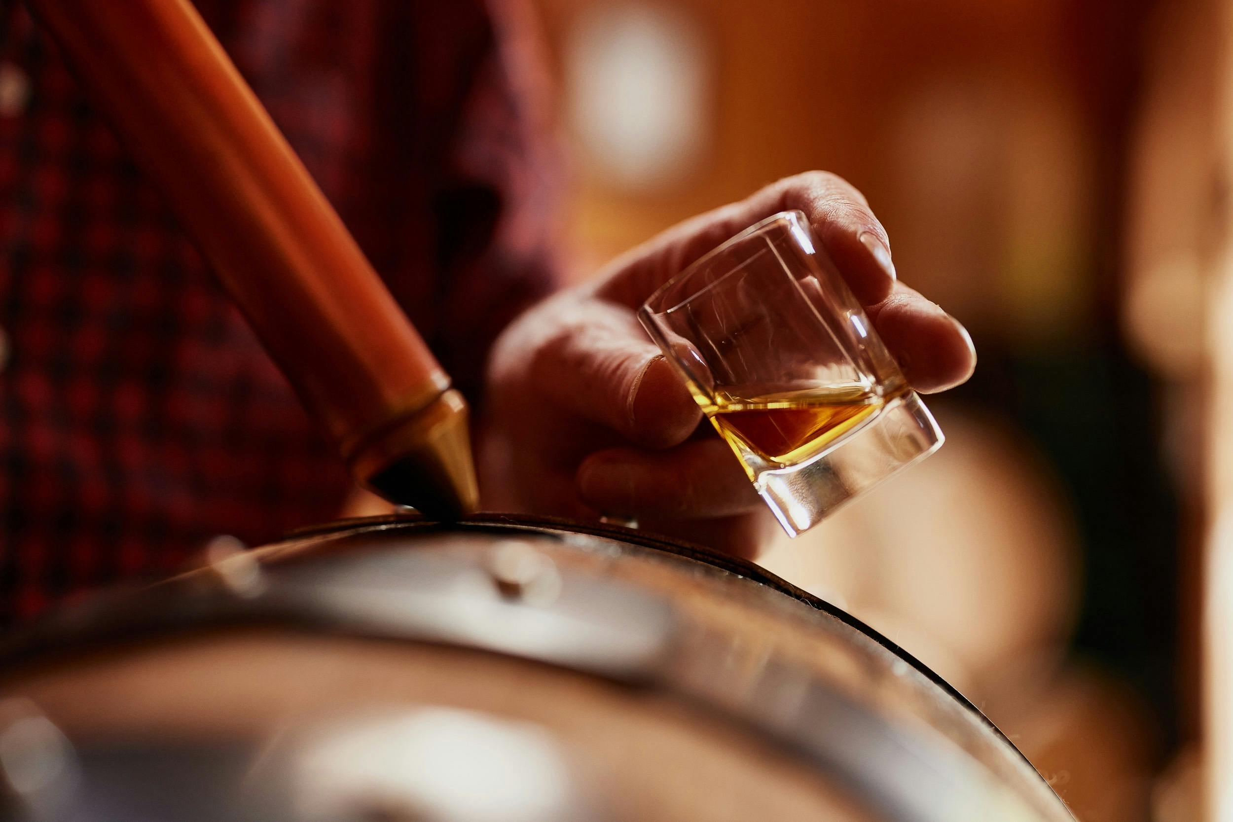 Taking a sample of whisky