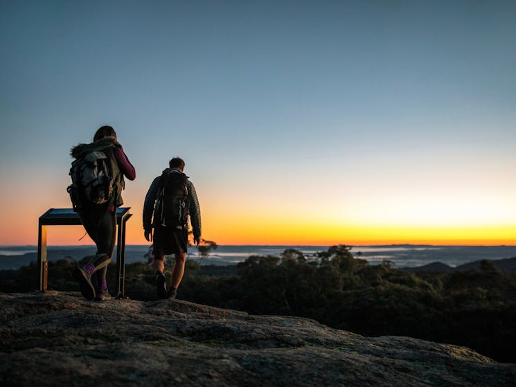 Couple enjoying a scenic walk through Woomargama National Park, Wantagong