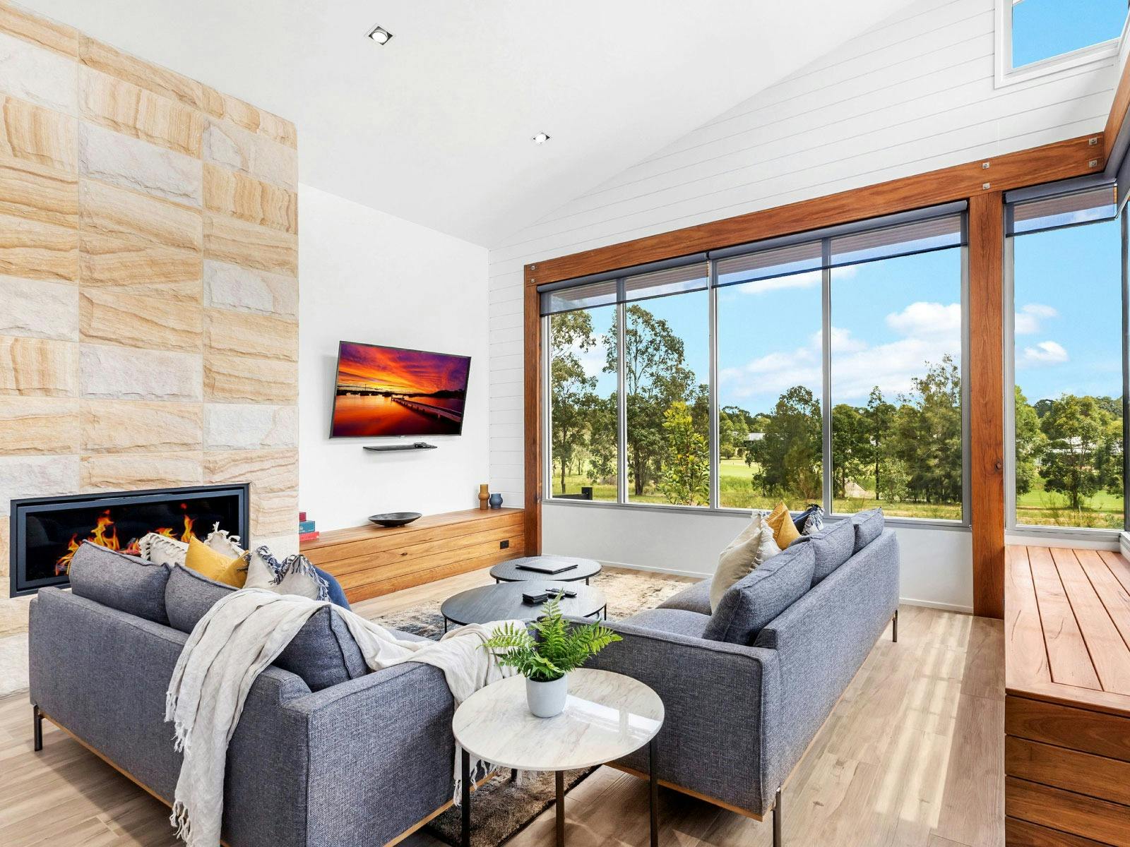 Jacoru On 3 lounge room with fireplace and TV