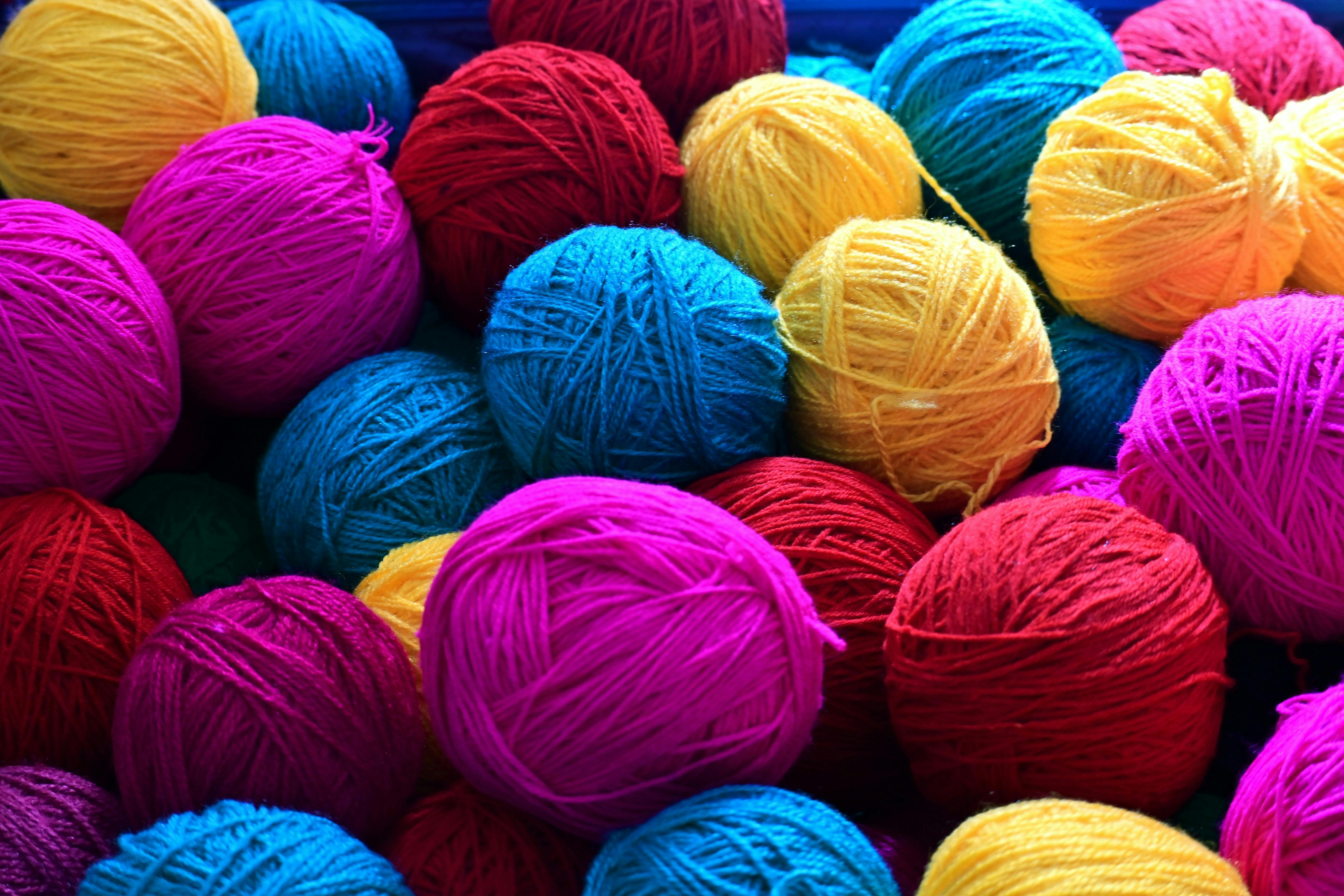 Pink, yellow, red and blue balls of wool