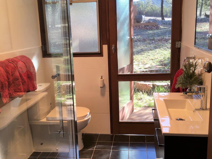 Shower, basin, toilet, door shows path to outdoor bath