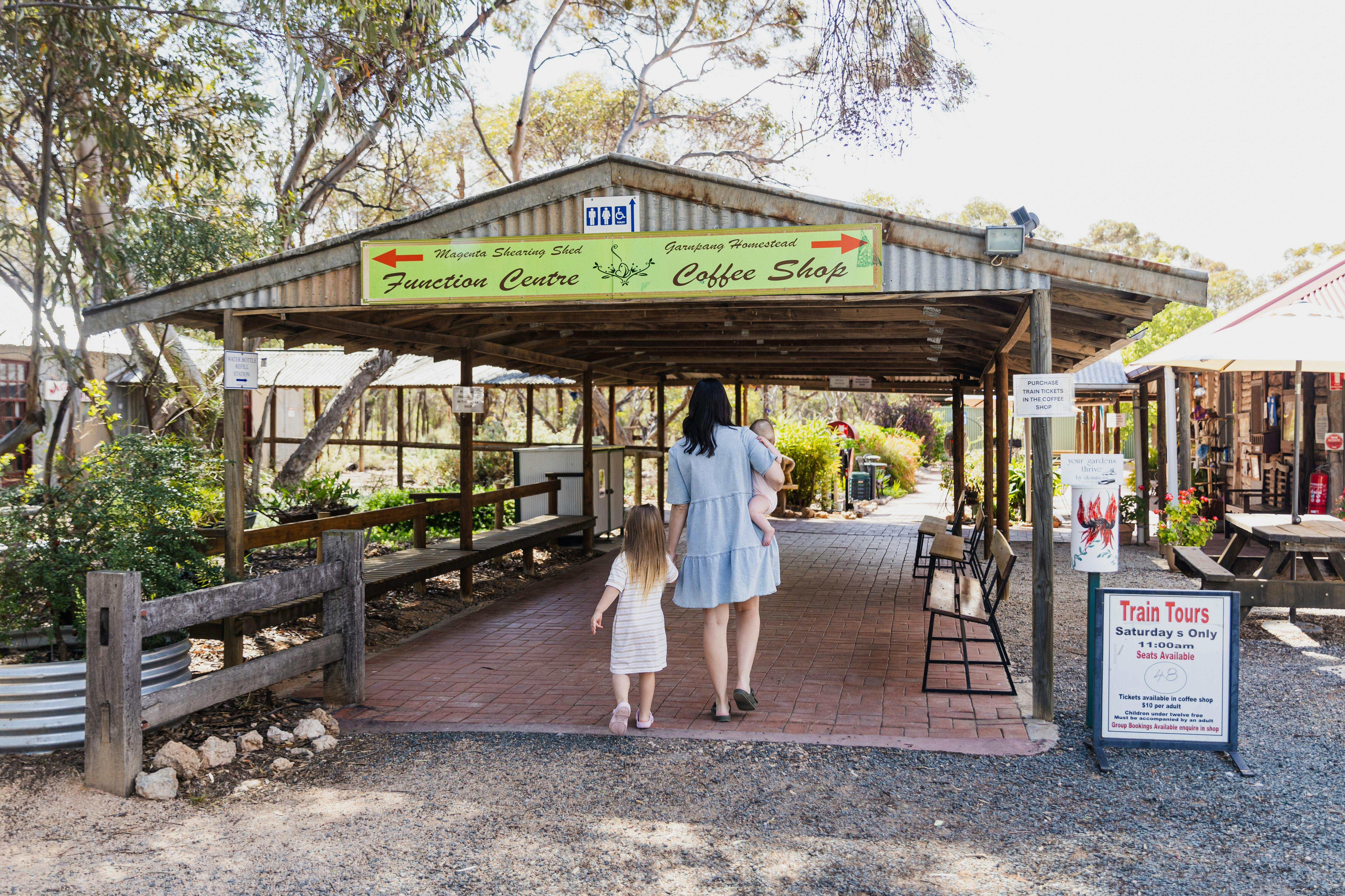 Mum and Daughter going into cafe