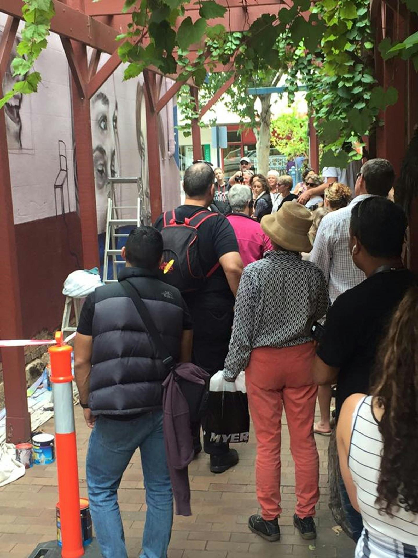 Visitors watching artists during past Benalla Street Art Festivals