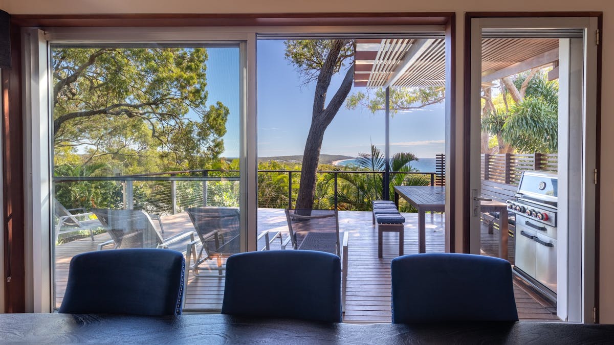 Dining leading to outdoor dining and BBQ space directly beside it.