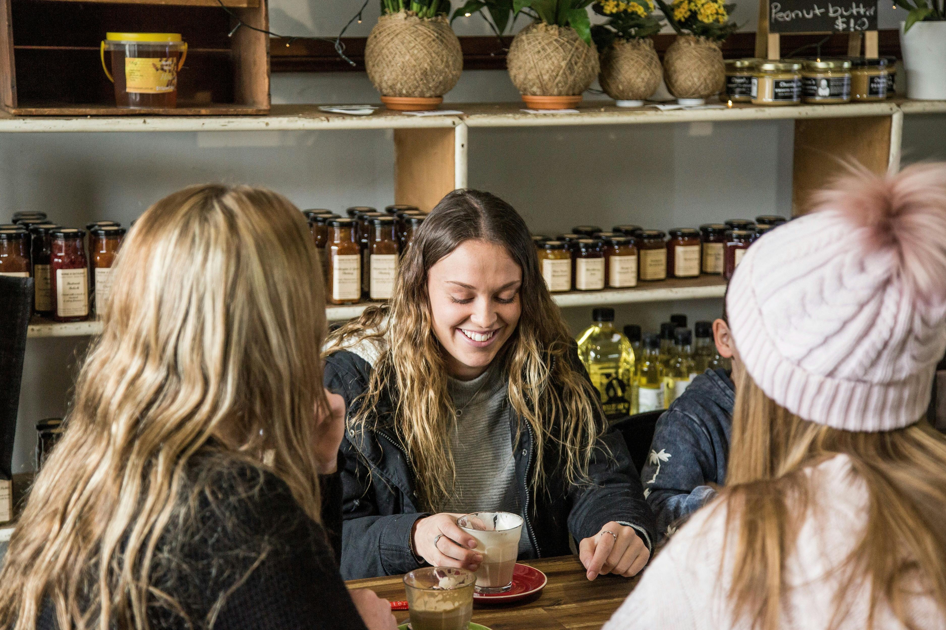 Friends catching up over coffee at The Village Grocer in Carcoar