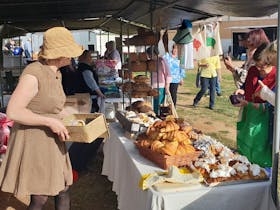 Market stall selling pastries and sour dough bread