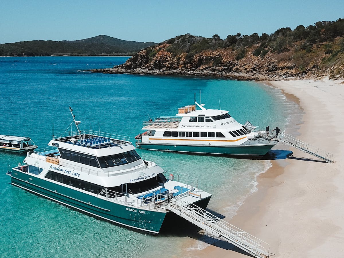 Step straight onto the white sands of Great Keppel Island—no jetties, just barefoot bliss!