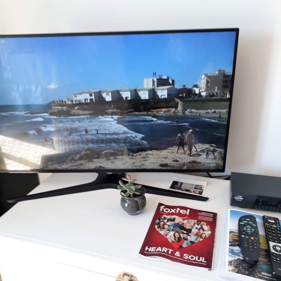 Large flat screen TV with Foxtel at Shutters by the Sea Luxury Waterfront Accommodation