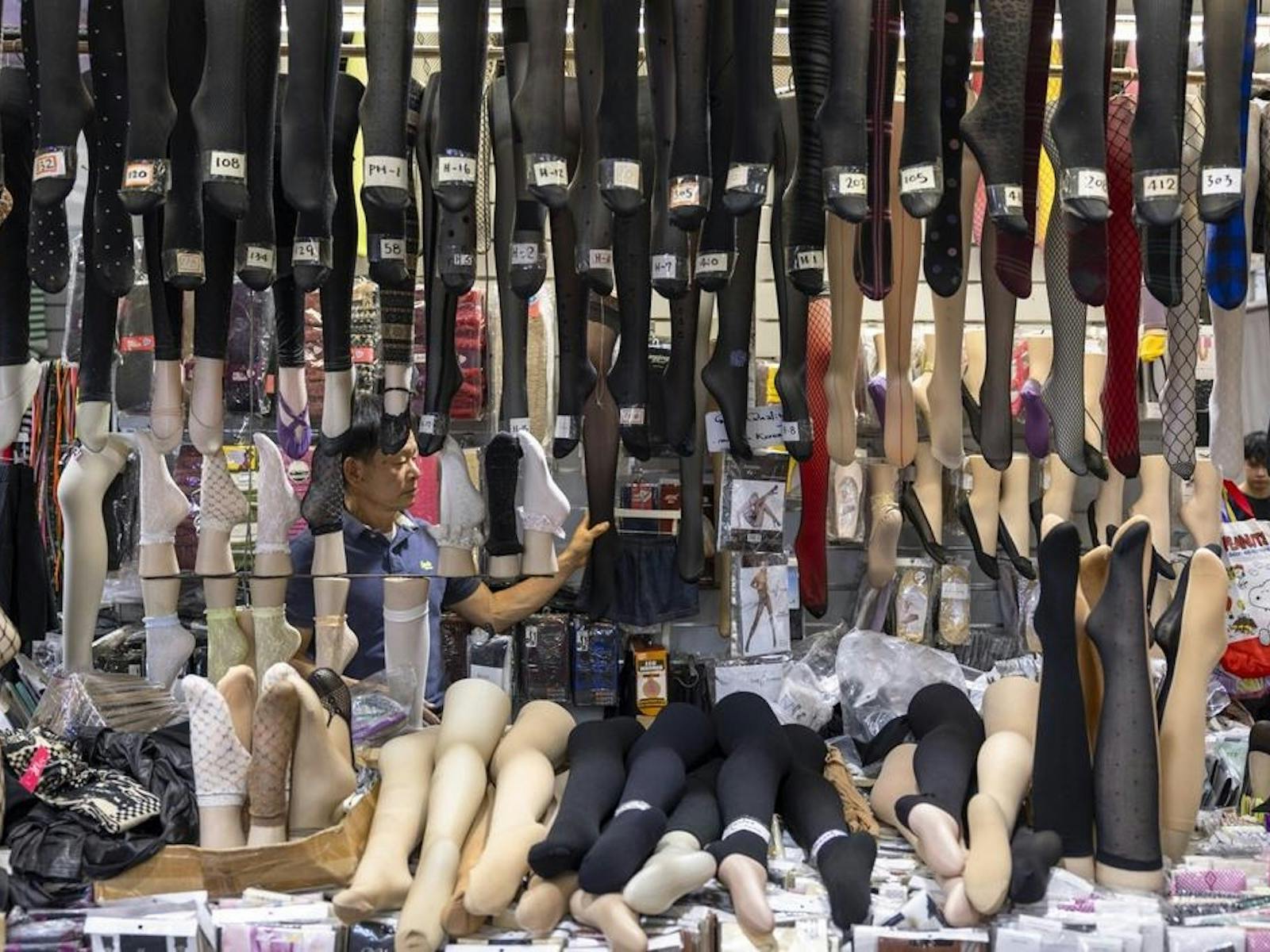 A photograph of socks and stockings at a market stall