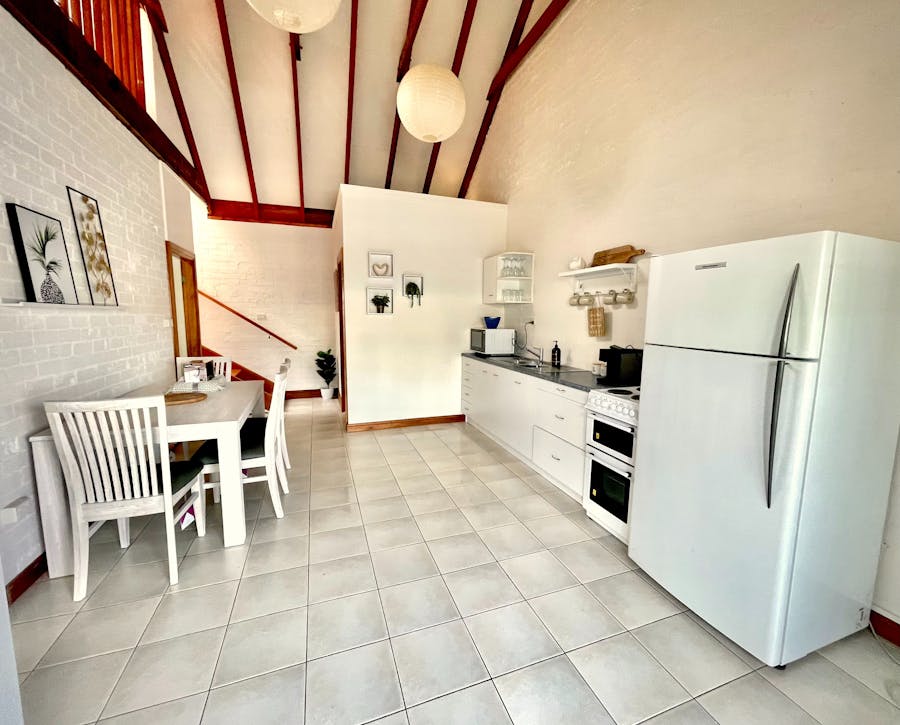 Freestanding Oven, Large Fridge, Dining Table
