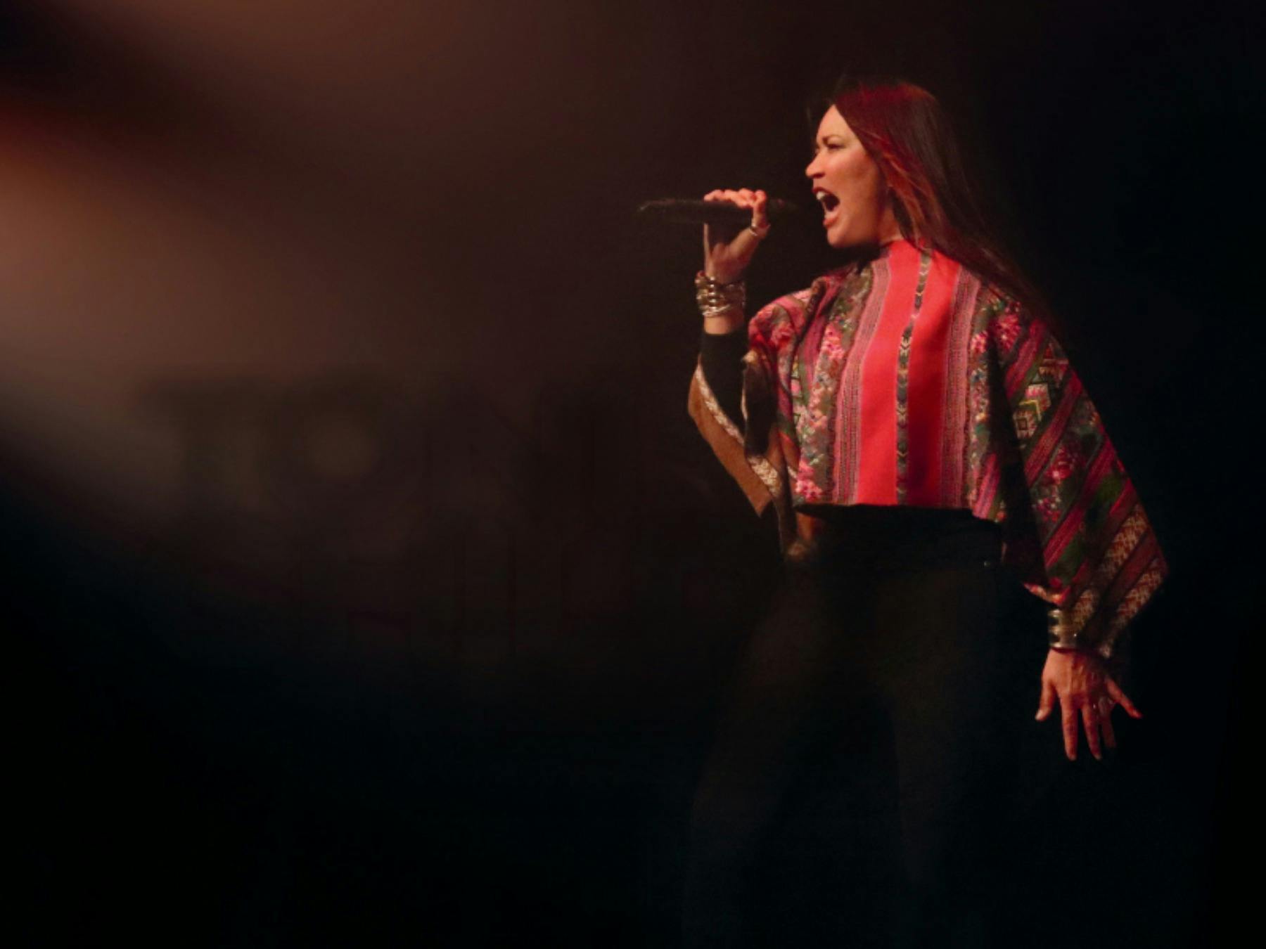 Woman on stage with mic