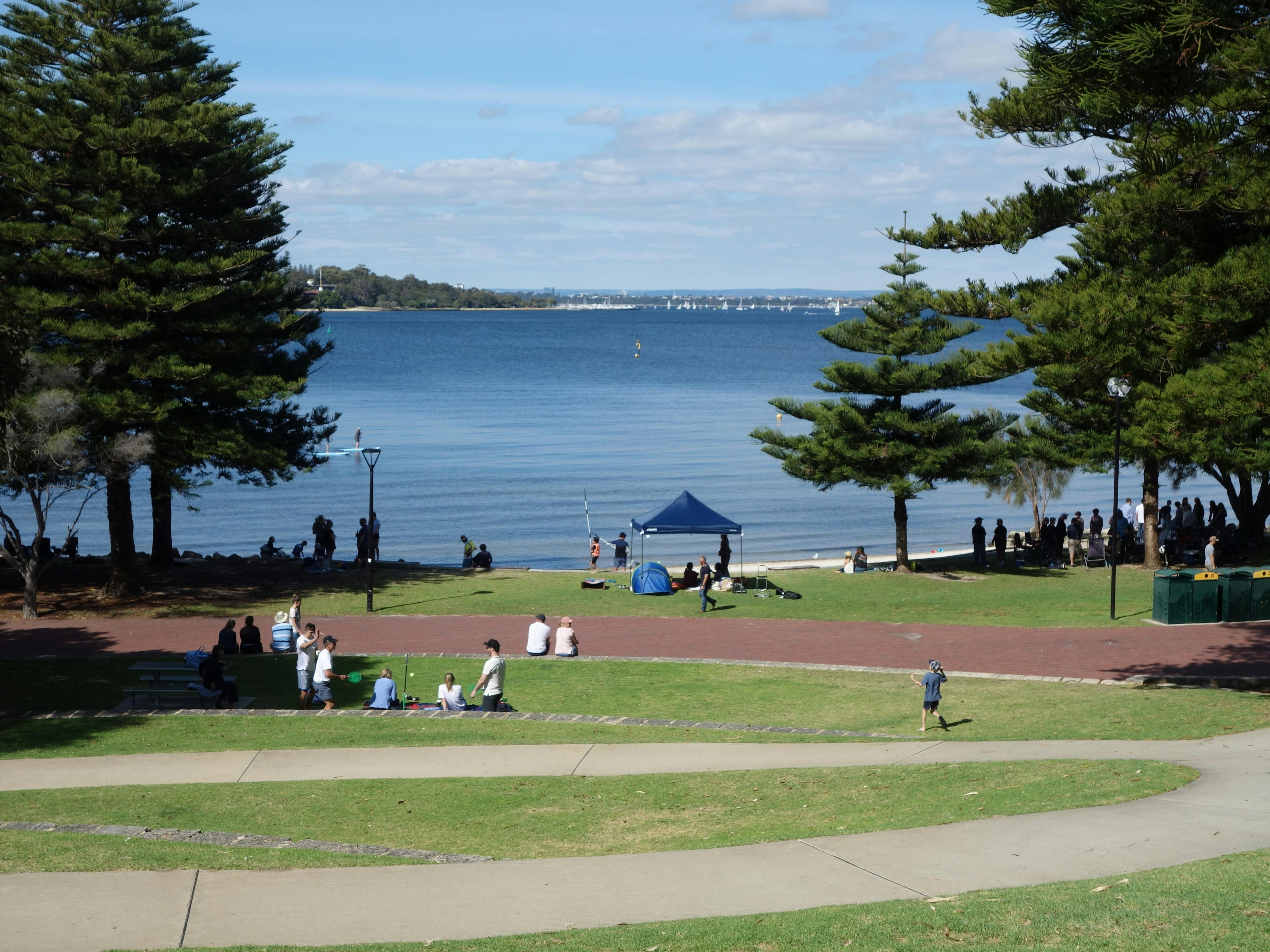 People picnicking by the river.