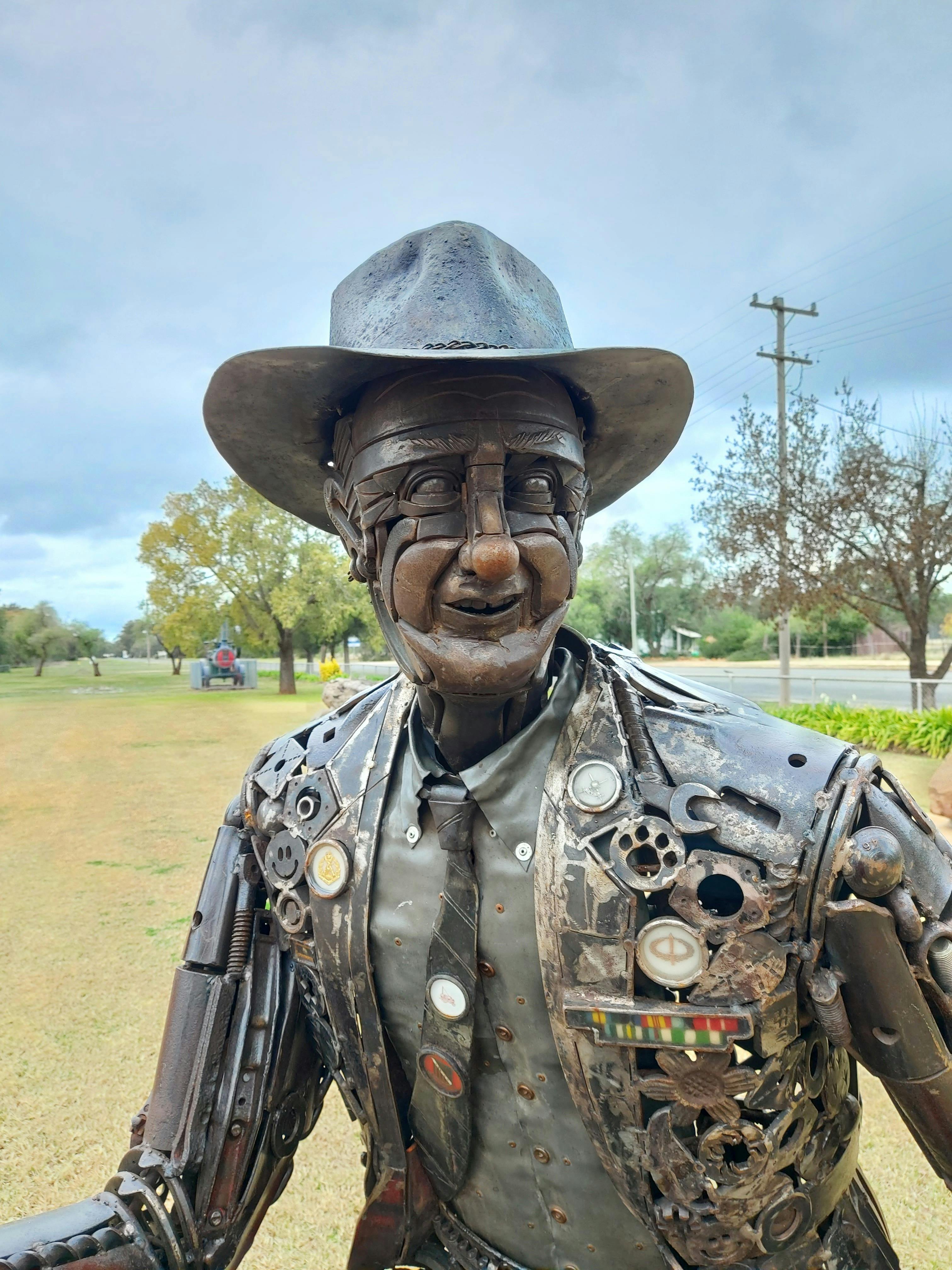 A close up of the face of the Tim Fischer metal sculpture at Boree Creek