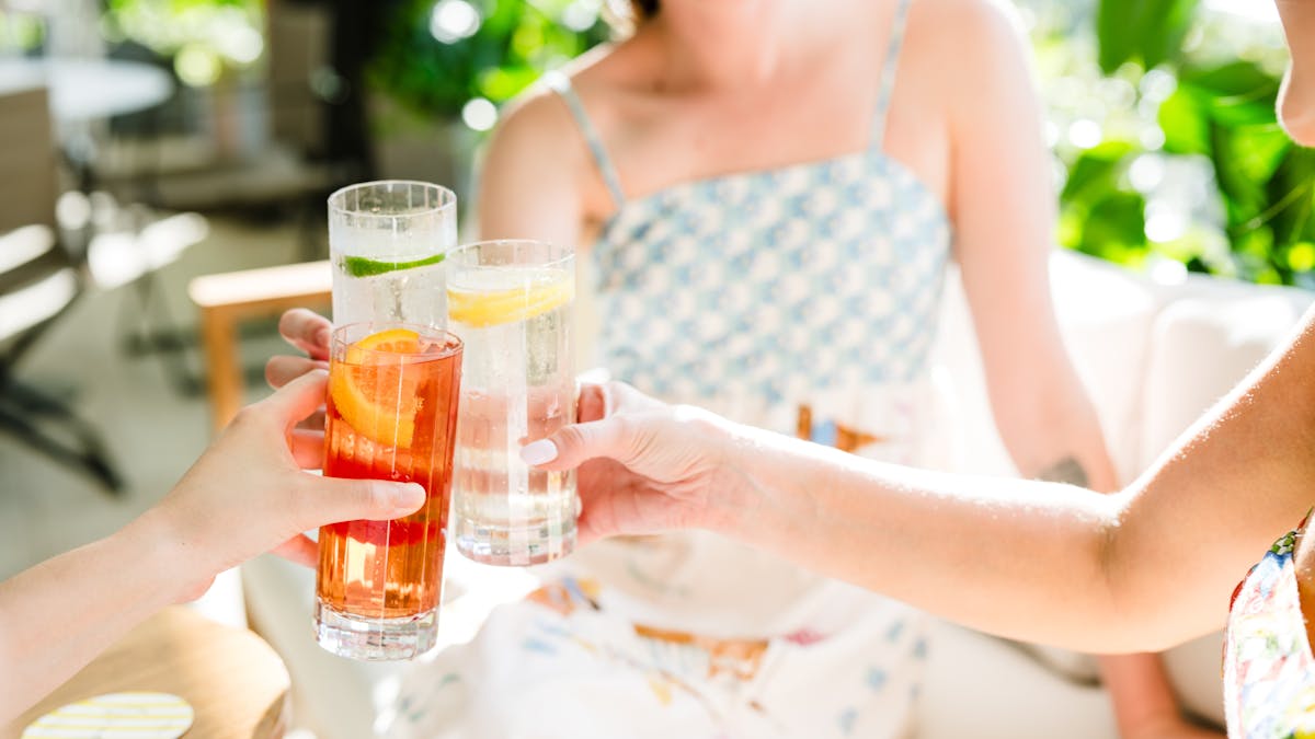 Indulge in Versa cocktails poolside with sweeping Brisbane skyline views