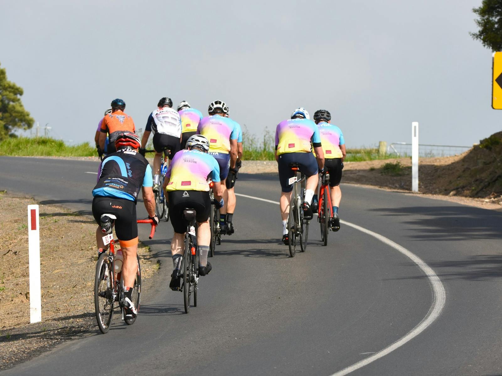 Cyclists riding up a hill