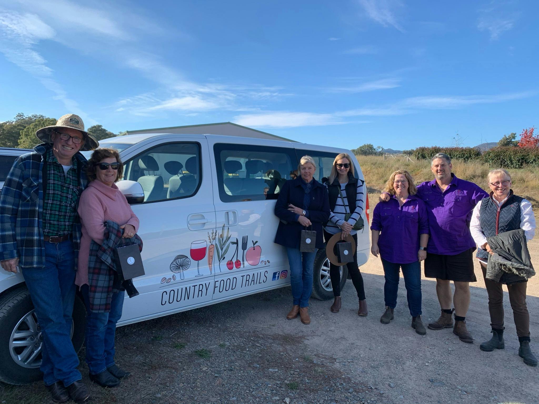 7 guests in front of Country Food Trails Van