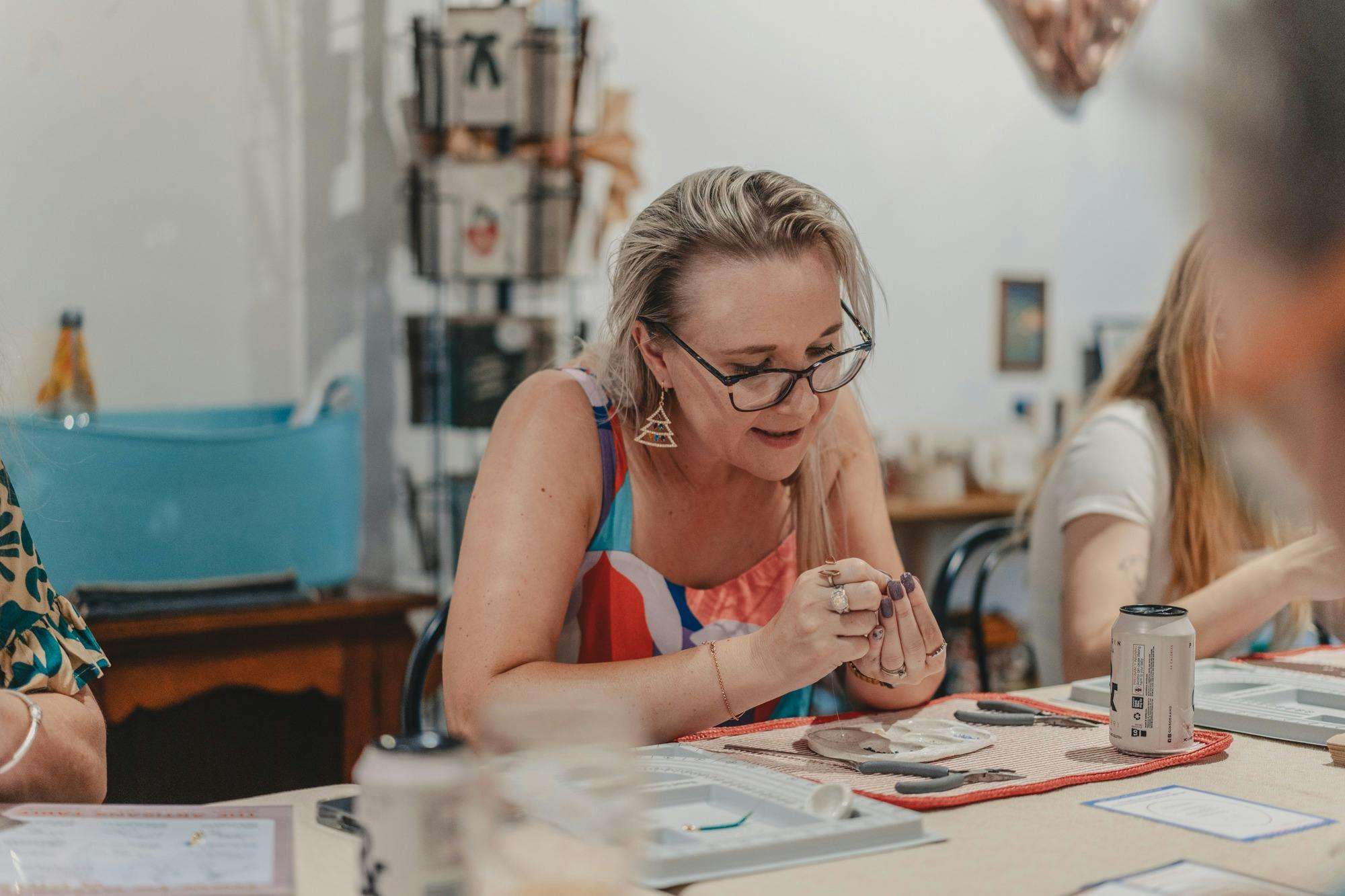 Woman beading during workshop