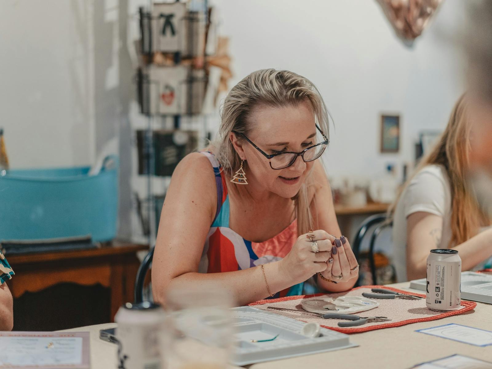 Woman beading during workshop