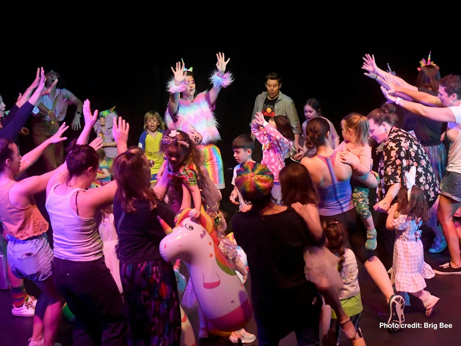 People at the dance party doing the hokey pokey
