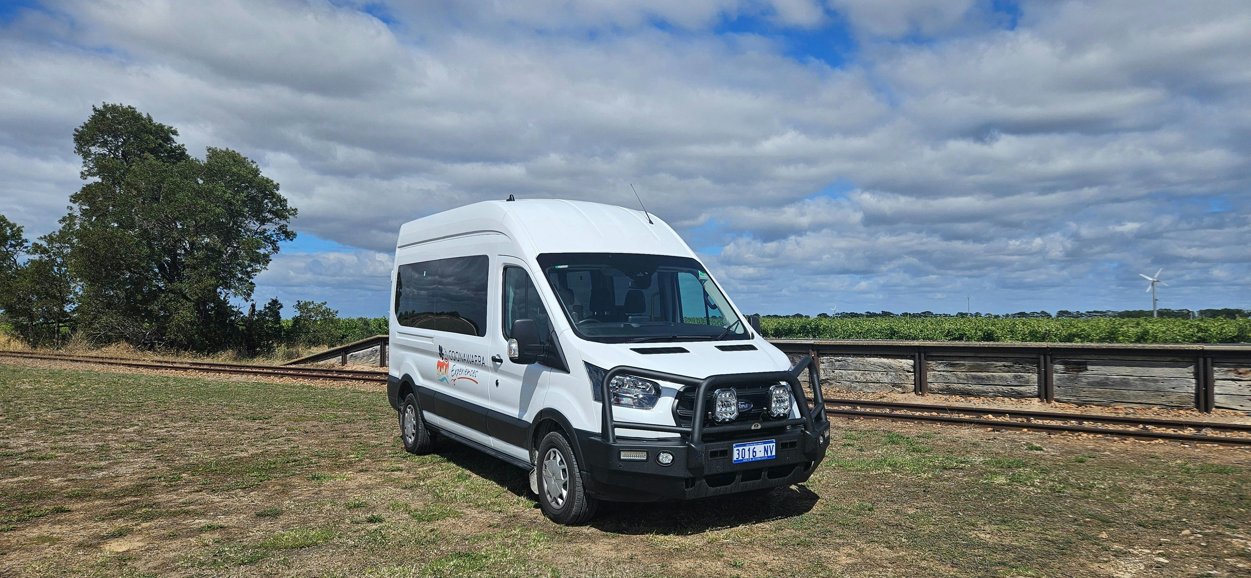 Ford Transit private wine tour vehicle parked at the Coonawarra Railway Siding landmark