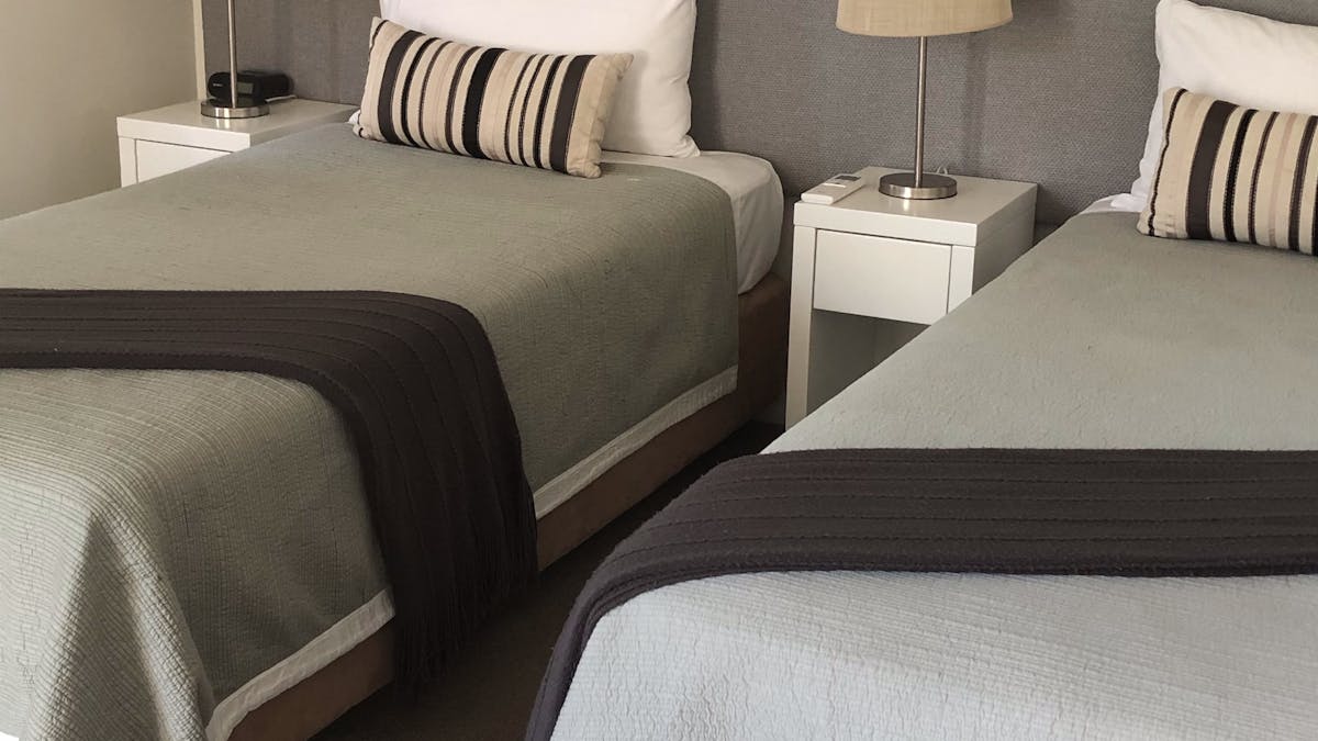 King single beds allow for flexibility of bedding configuration