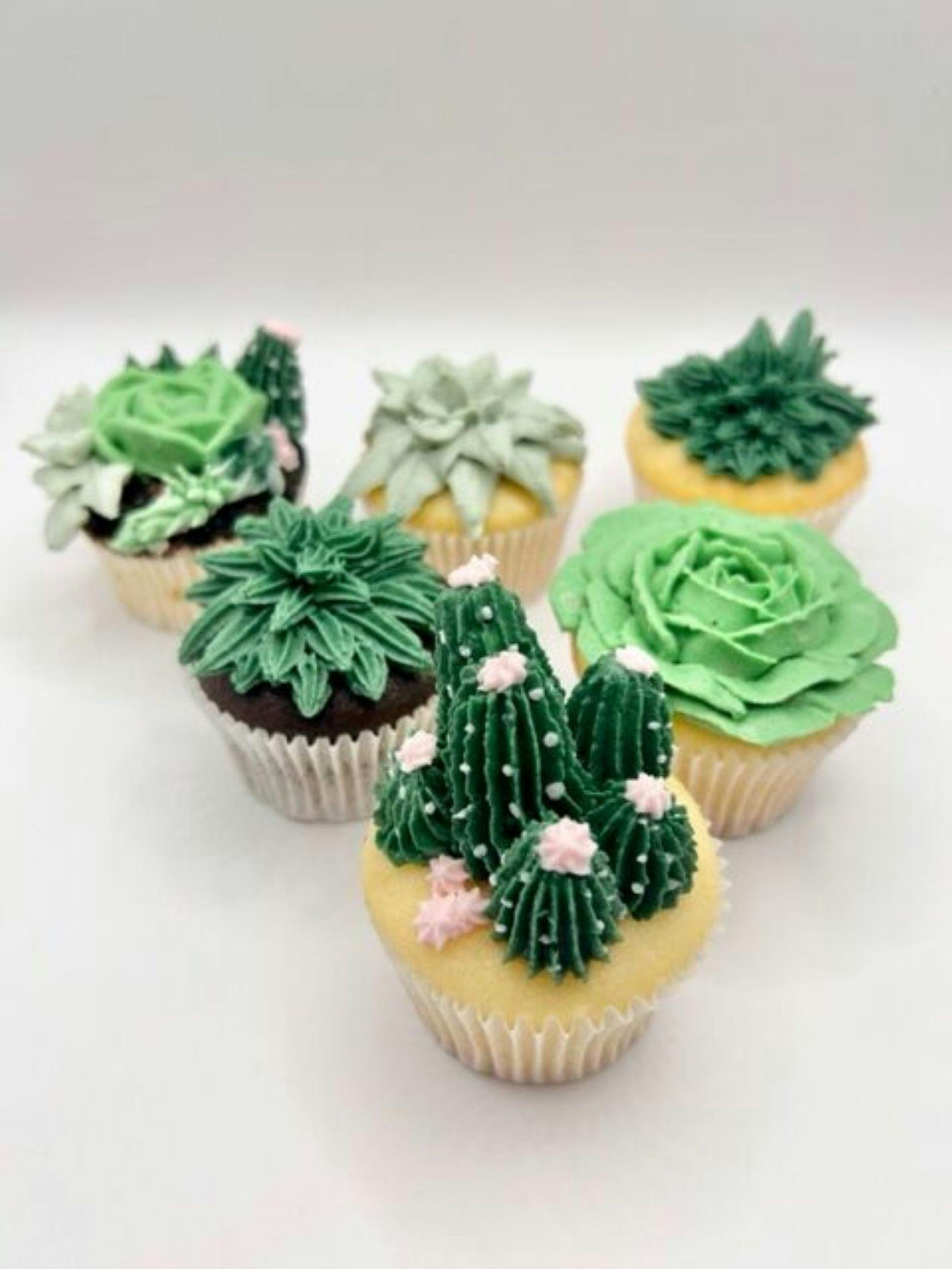 6 cupcakes with green buttercream piping in the style of succulents and cacti