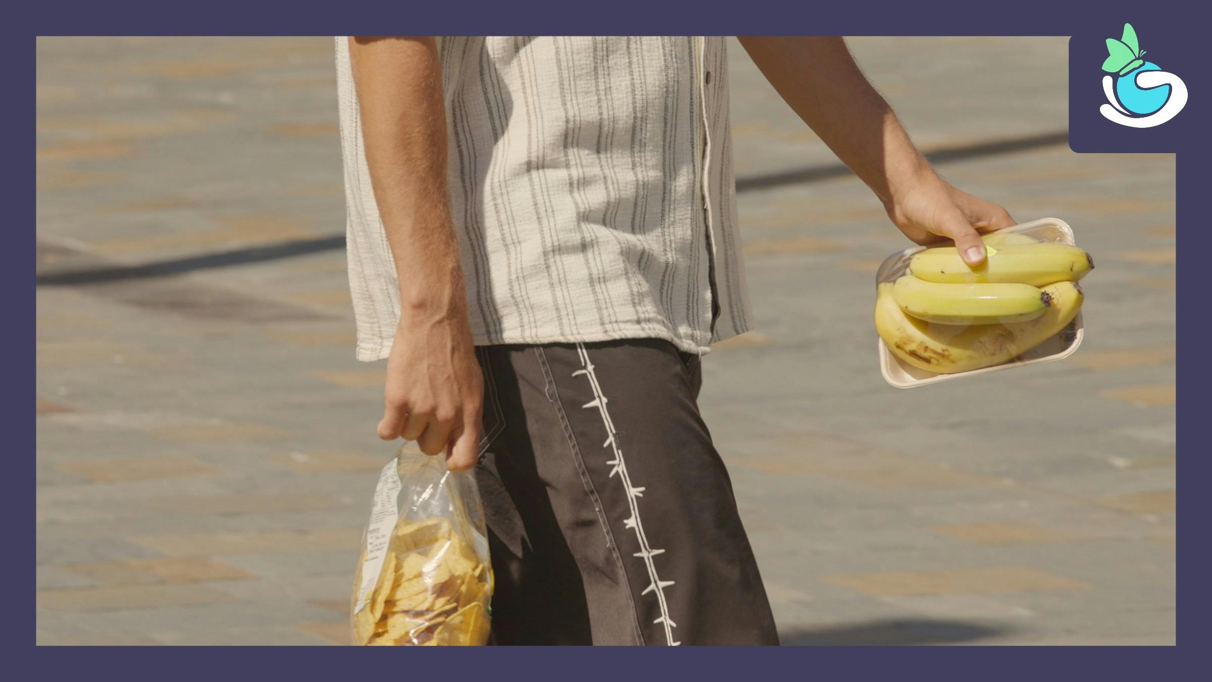 Man carrying food in plastic packaging
