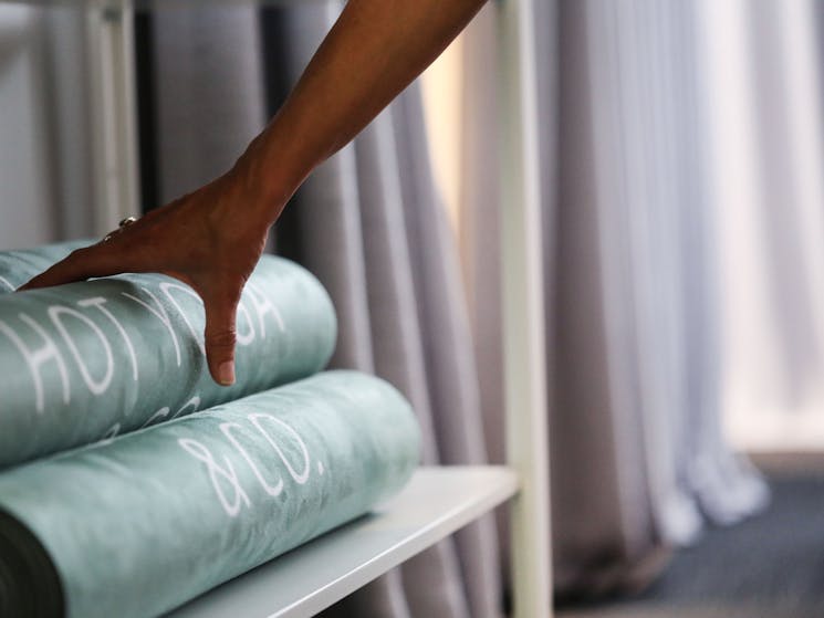 Yoga mats and towels are available at our studio