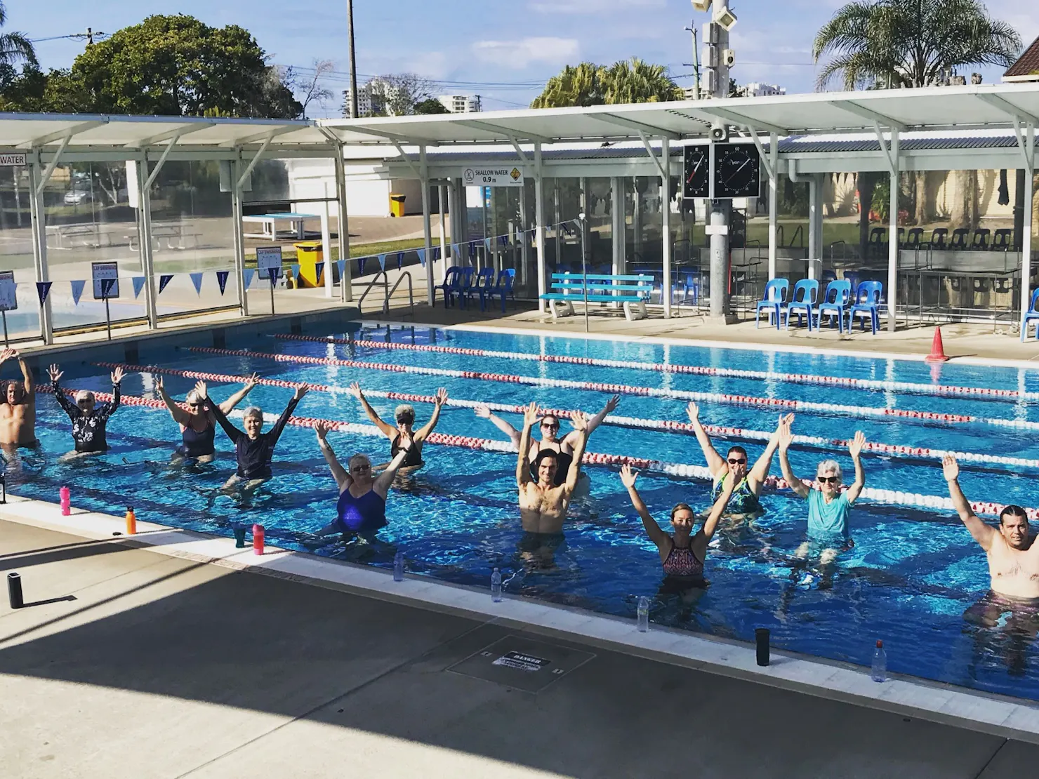 group having fun water cycling