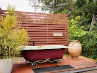 Outdoor bathtub at the hitching rail retreat, the perfect spot to relax and stargaze, north qld