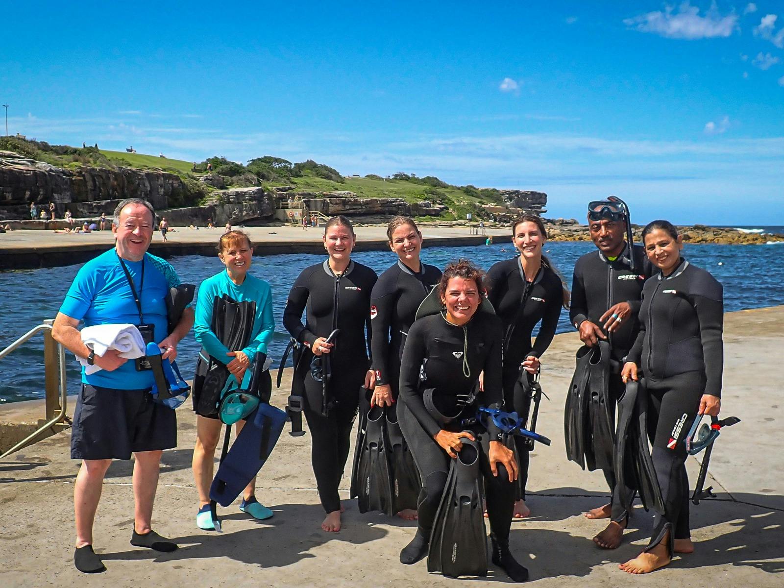 A group of snorkellers preparing for their guided tour at Clovelly Beach