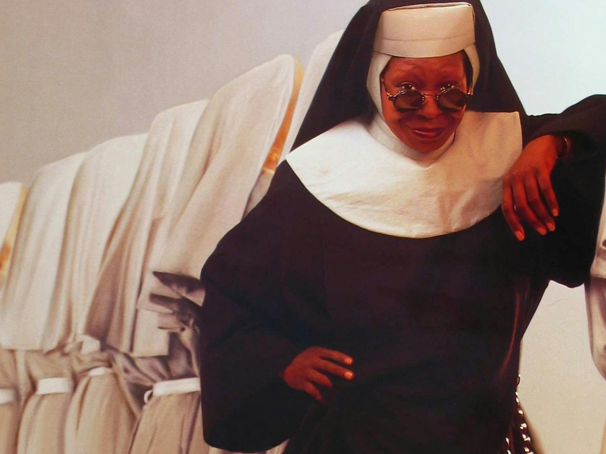Still from Sister Act showing a woman dressed in a nun's habit wearing sunglasses