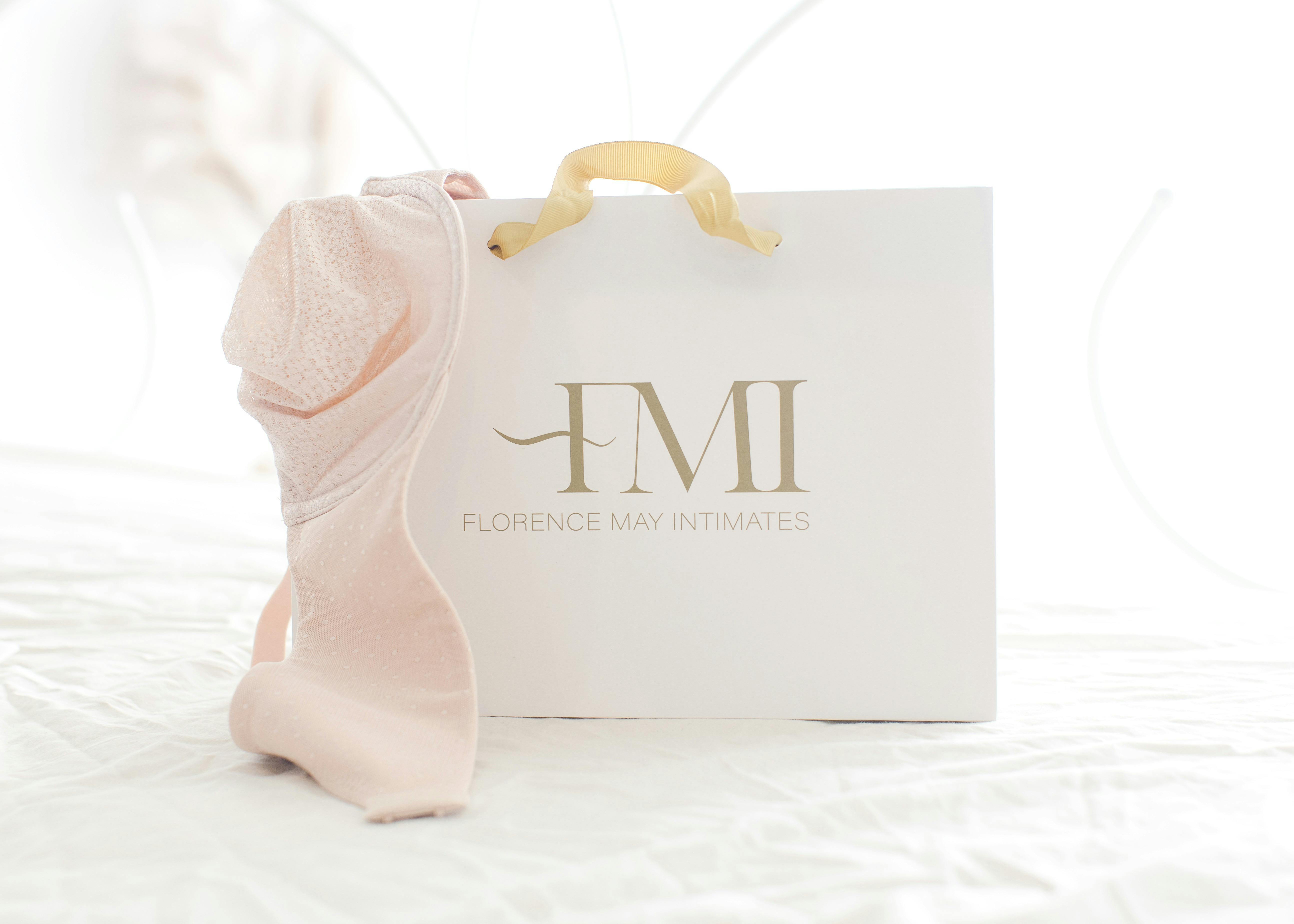 Photo showing the FMI bag and a soft pink bra