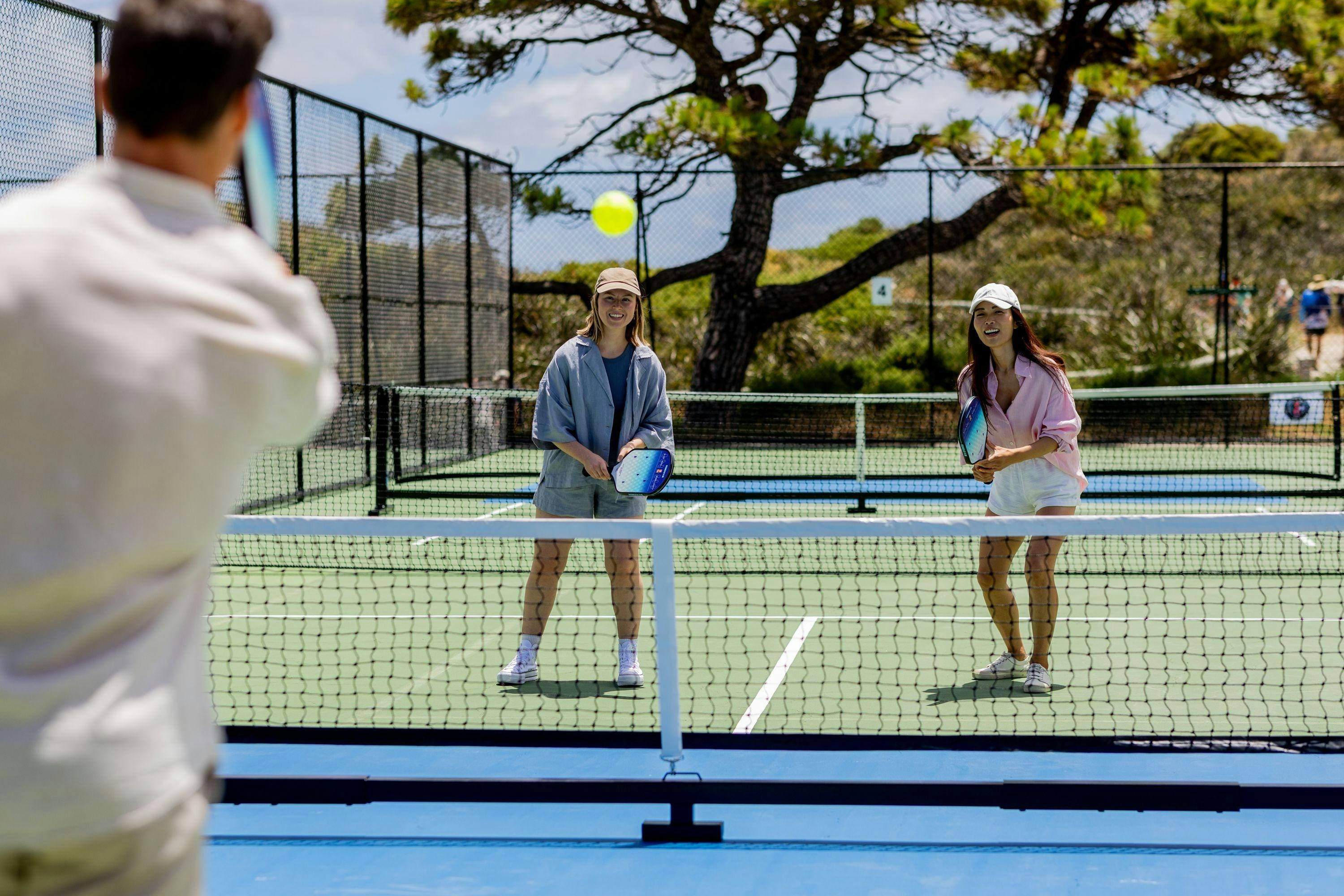 Visitors playing pickleball at the Bathurst Point courts on Wadjemup / Rottnest Island.