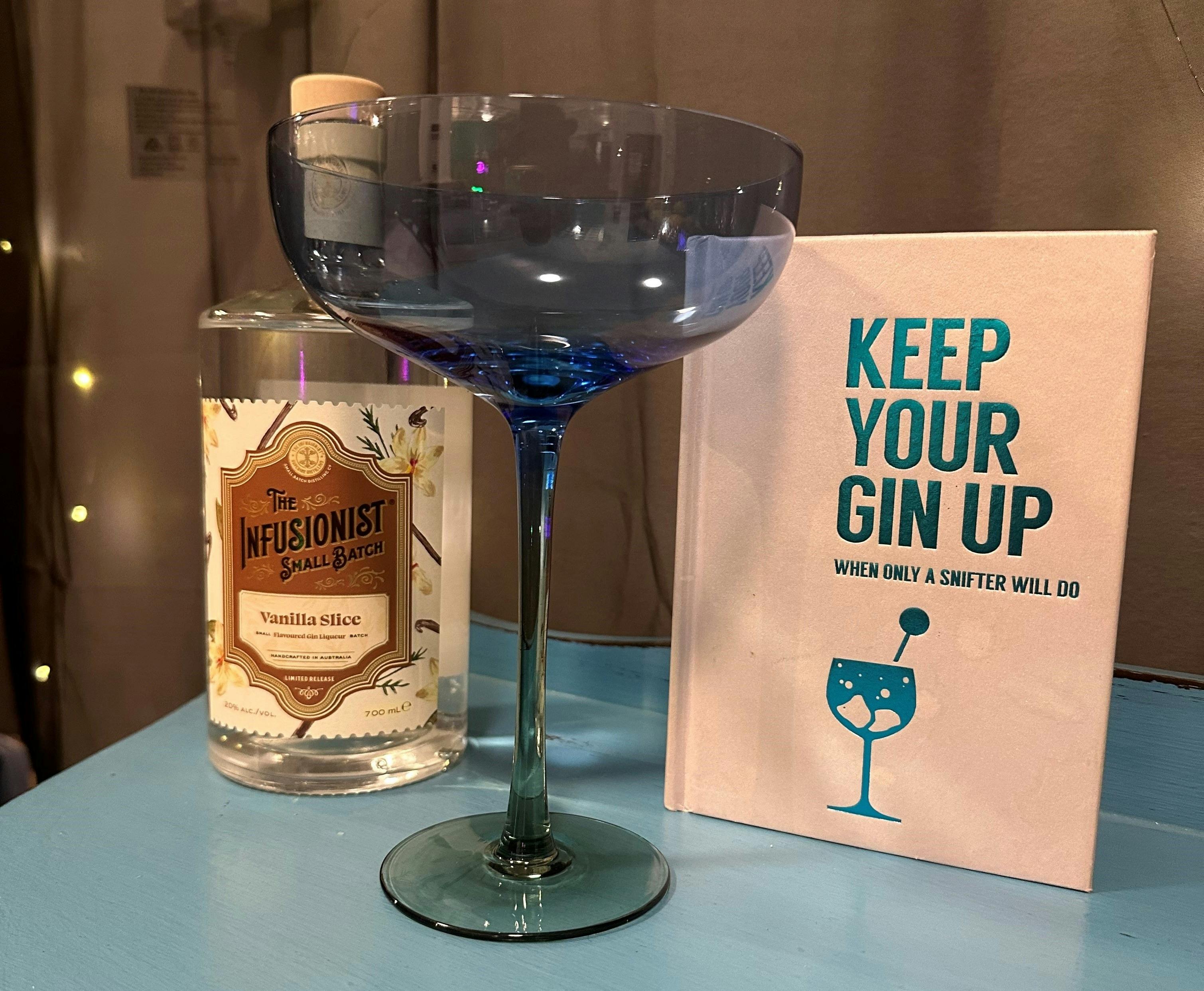 Gin martini set up with a book