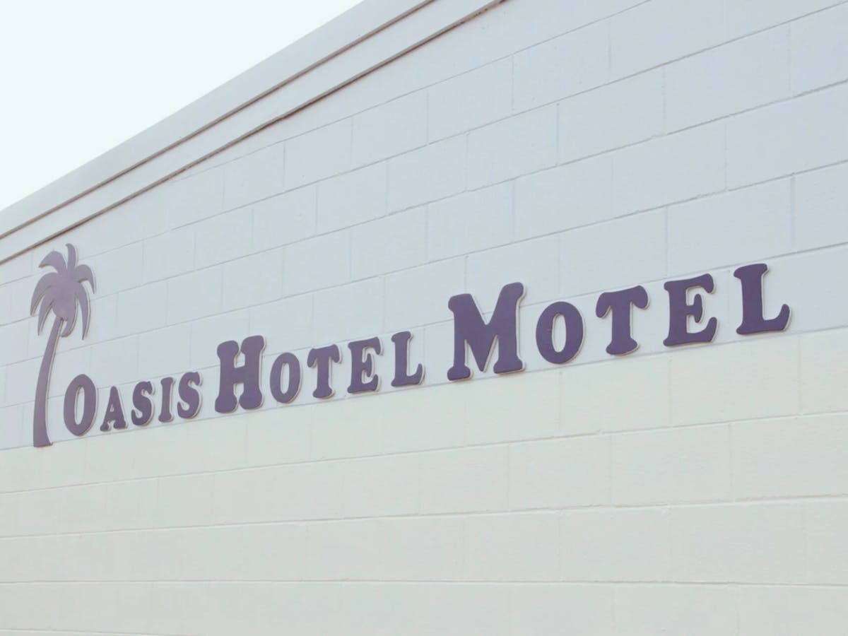 Oasis Hotel Motel Sign