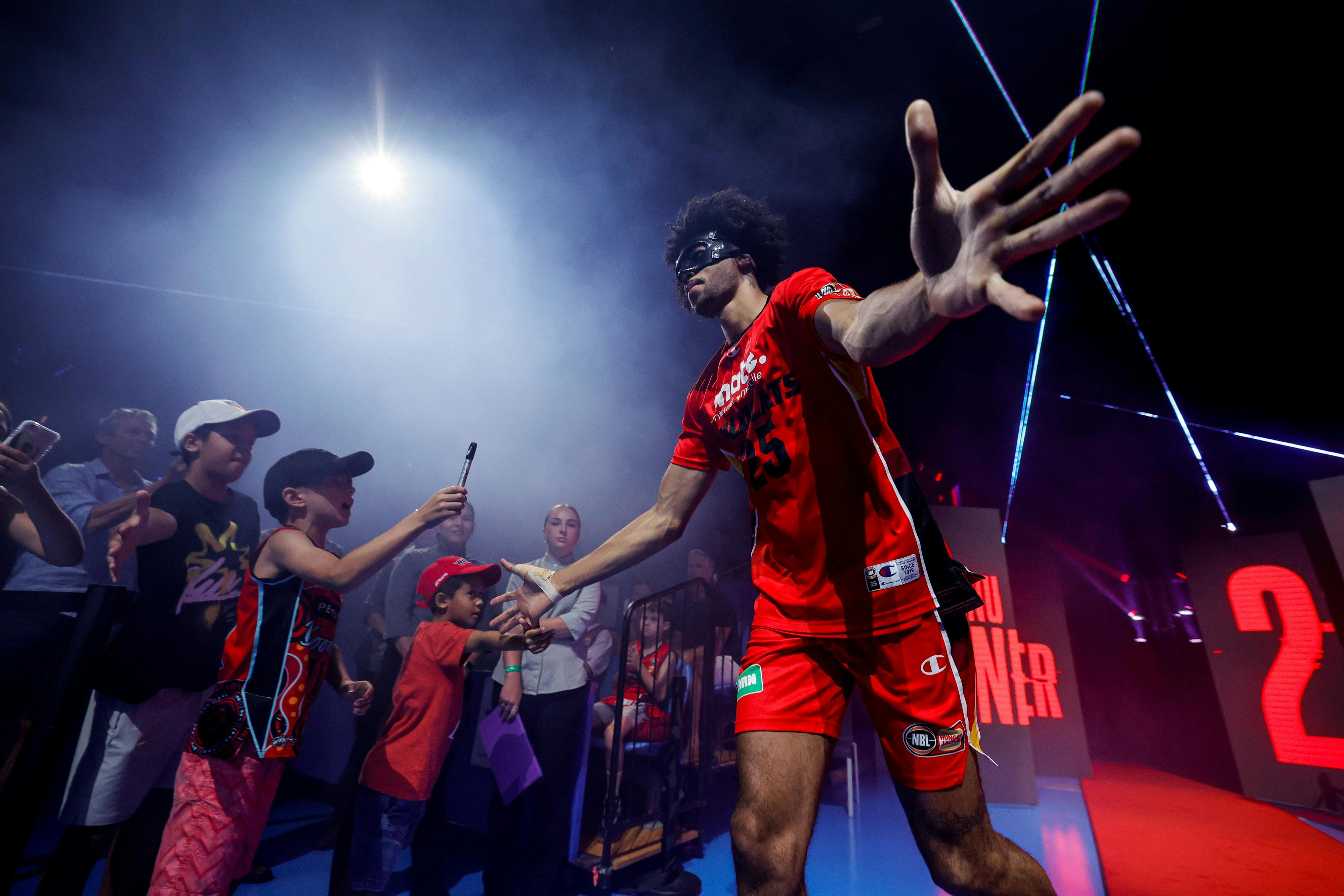 Keanu Pinder high fives the fans