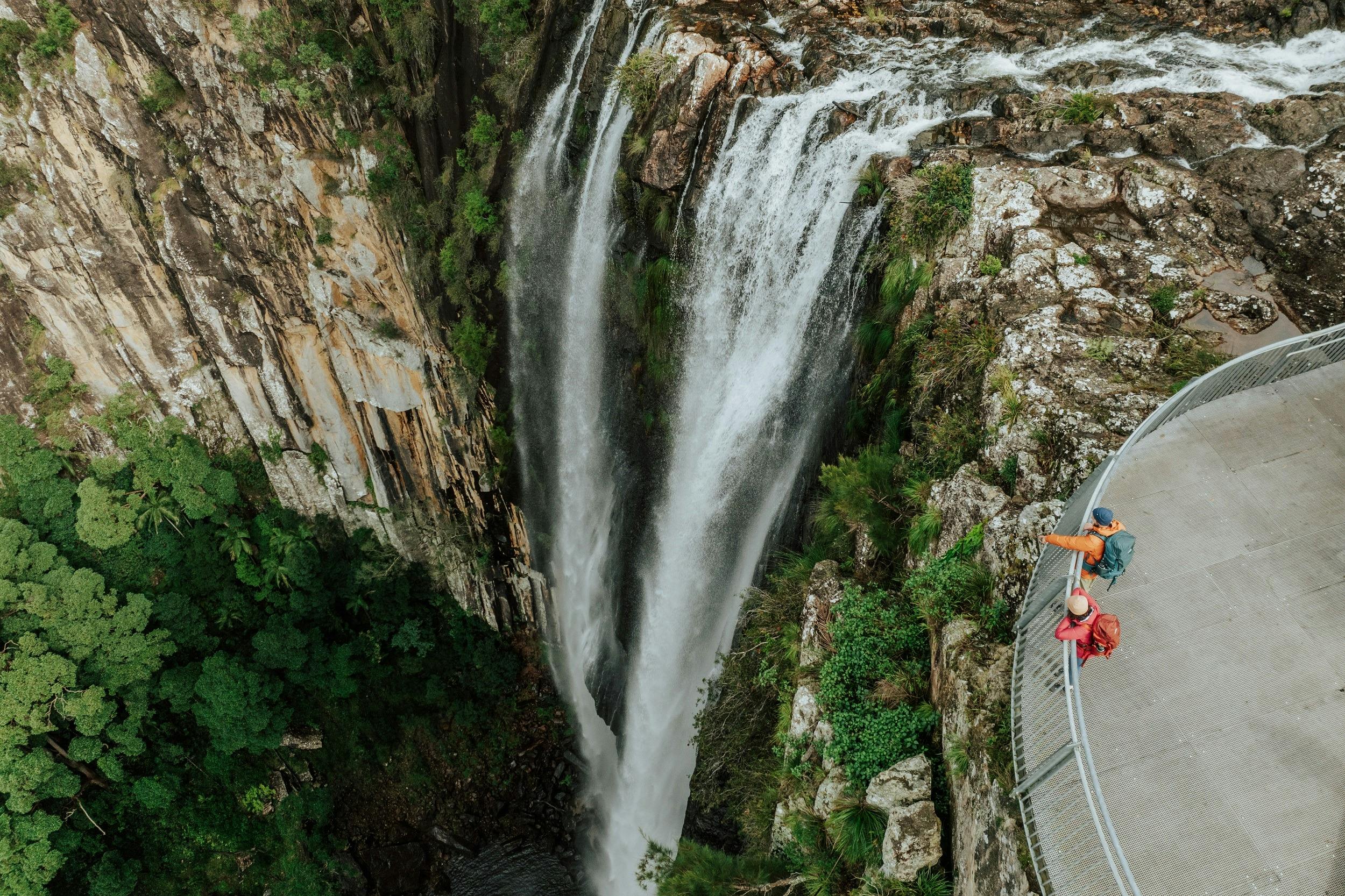 Two hikers check out the epic view from Minyon Falls lookout.