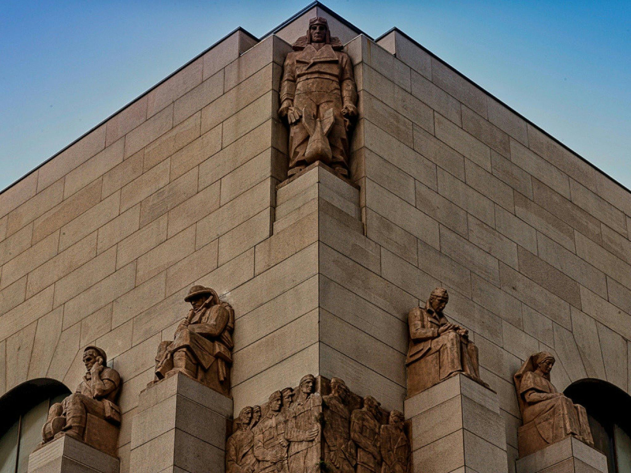 Rayner Hoff's cast granite sculptors atop the Memorial's south- western corner