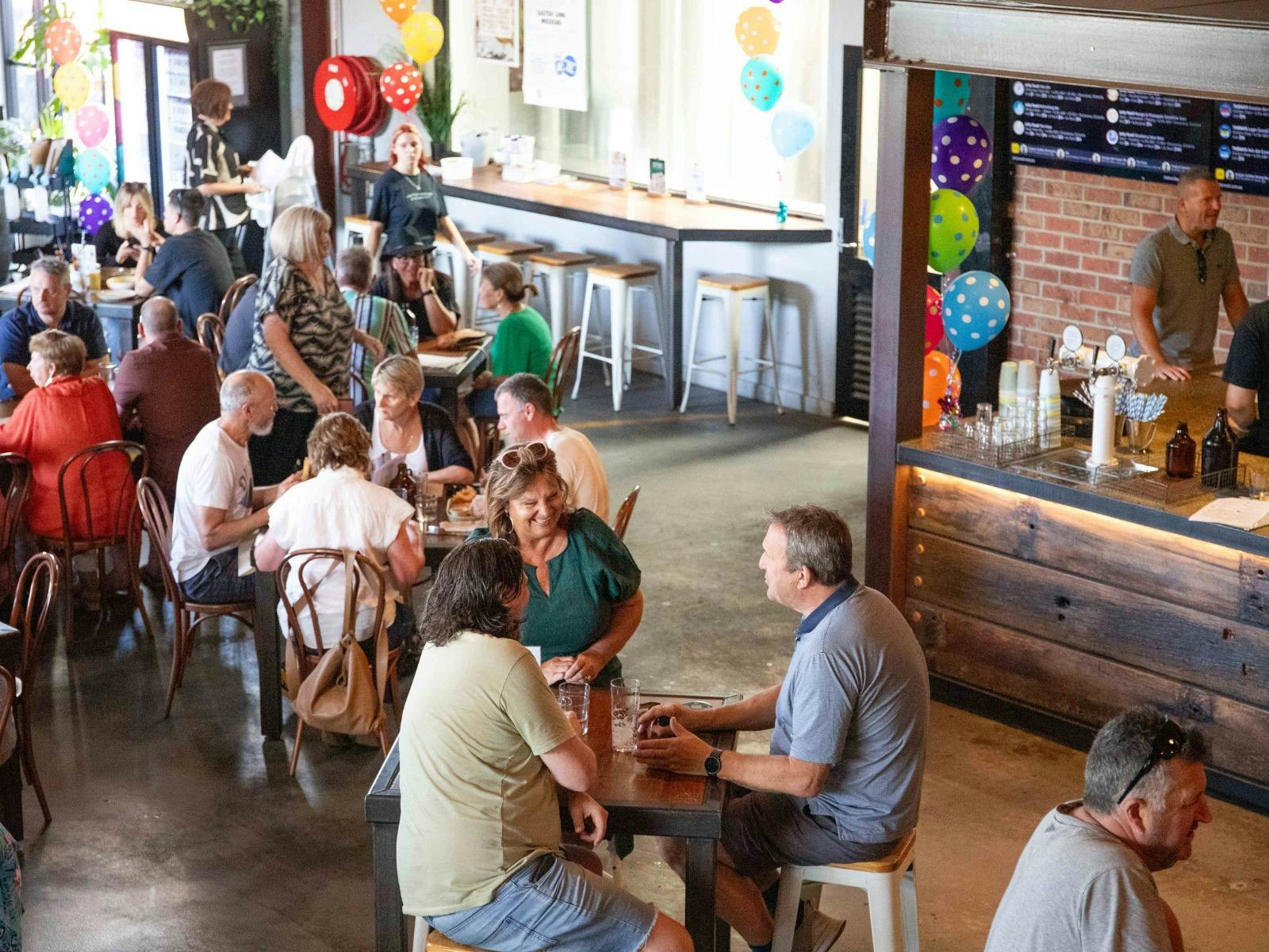 People at a bar sitting on stools