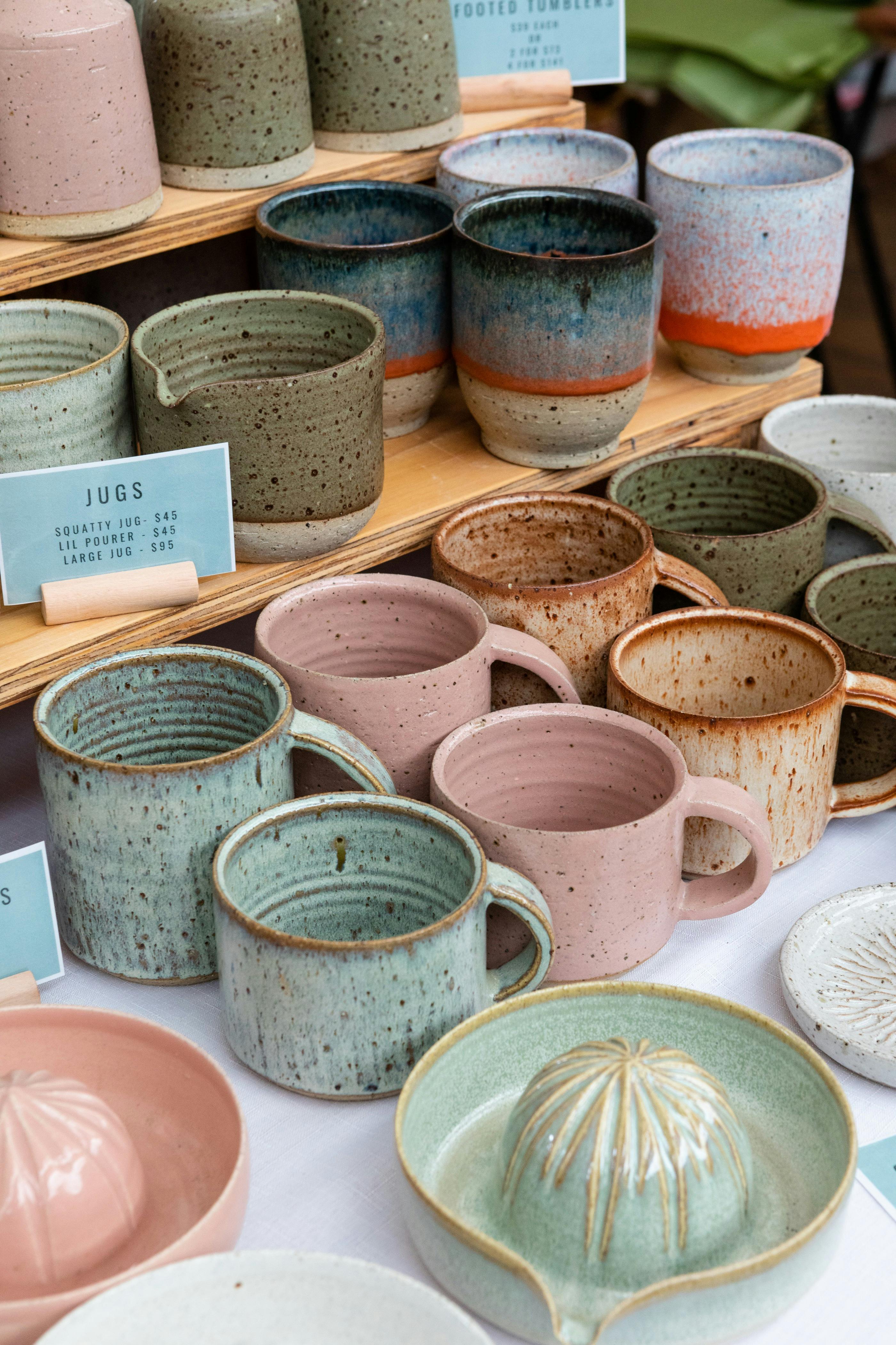 Ceramic jugs and mugs on display