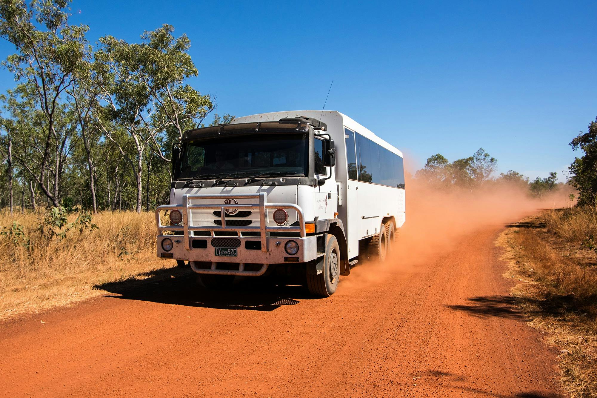 6WD tour coach driving along a dirt road