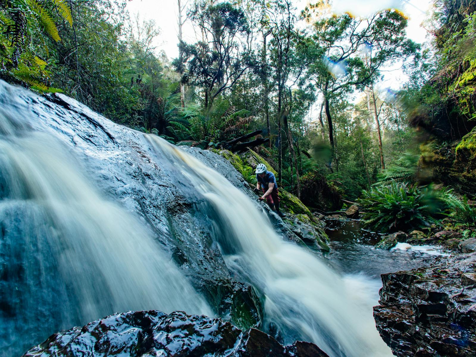 Biker cools off at waterfall